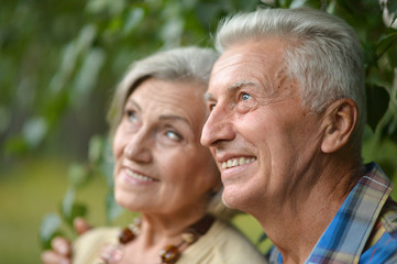 Mature couple on  walk  in summer
