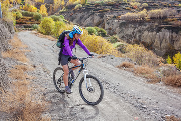 Biker-girl in Himalaya mountains, Anapurna region