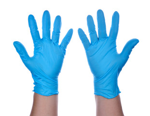 Hands of a medic wearing a blue latex gloves