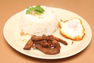 Thailand style fried rice, fried meat with garlic, pepper, put a fried egg.