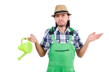 Young cheerful gardener with watering can isolated on white