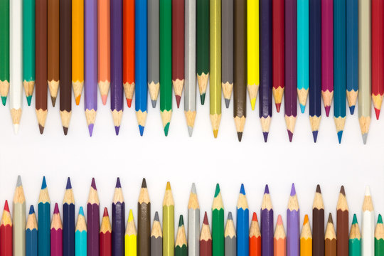 Close up set of multiple colour wooden pencils on white background