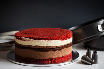 Naked layer cake with red velvet and chocolate biscuit and cream