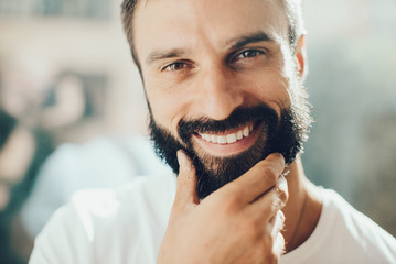 Portrait of smiling young man on the blure background