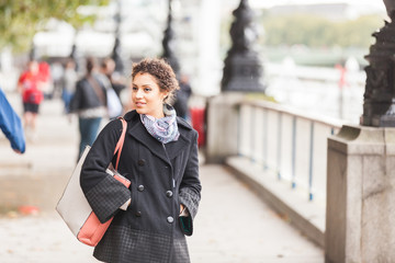 Young mixed race woman walking in London