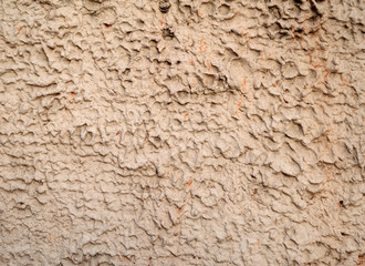Texture of old wall covered with yellow stucco