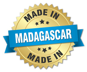 made in Madagascar gold badge with blue ribbon