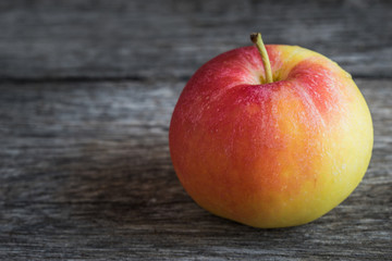 Apples on old wooden background.