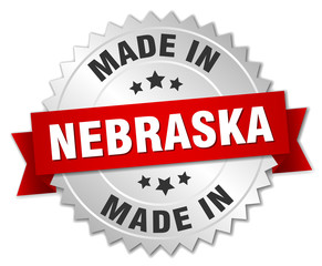 made in Nebraska silver badge with red ribbon