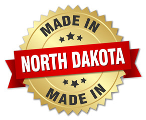 Obraz premium made in North Dakota gold badge with red ribbon