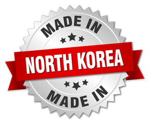 Obraz premium made in North Korea silver badge with red ribbon