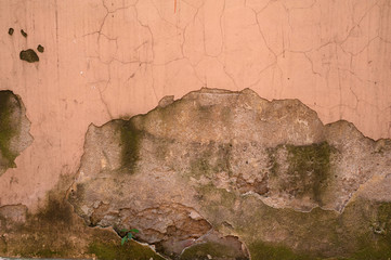 Texture of old wall covered with brown stucco
