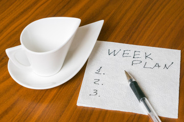 empty cup with handwriting week plan on napkin 2