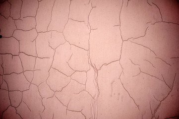 Texture of old wall covered with pink stucco