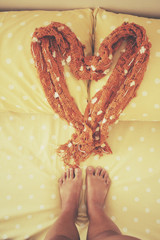 Selfie of scarf on bed pillows at hotel