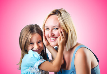 Happy mom and daughter on white