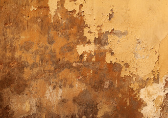Obraz premium Texture of old wall covered with yellow stucco