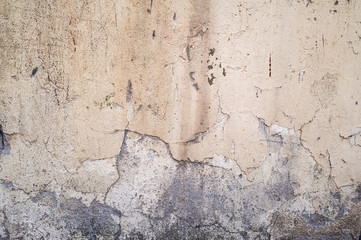 Texture of old wall covered with yellow stucco