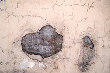 Texture of old wall covered with pink stucco