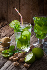 Fresh mojito cocktail on a wooden table