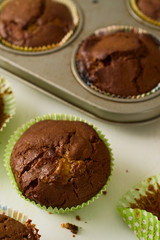 Fototapeta na wymiar Freshly baked homemade chocolate chip muffins on white table
