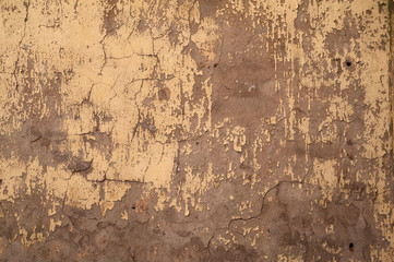 Textur der alten Mauer mit gelbem Stuck bedeckt