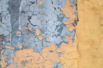 Texture of old wall covered with yellow stucco