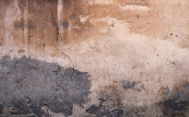 Texture of old wall covered with brown stucco