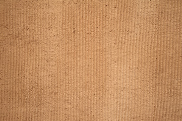 Texture of old wall covered with brown stucco