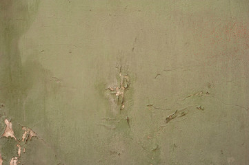 Texture of old wall covered with green stucco