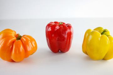 colourful garden peppers on a white background 