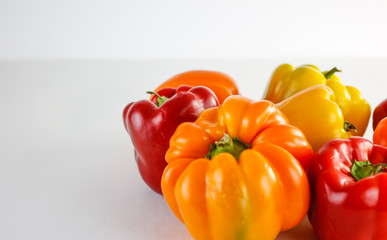 colourful garden peppers on a white background 