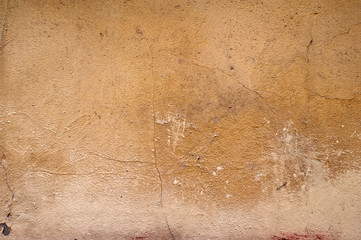 Texture of old wall covered with brown stucco