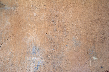 Texture of old wall covered with brown stucco