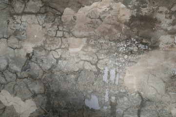 Texture of old wall covered with gray stucco