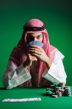 Arab man playing in the casino