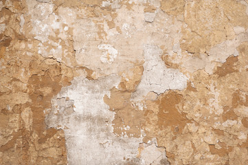 Texture of old wall covered with brown stucco