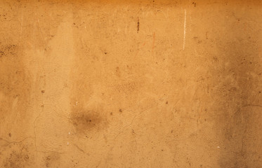 Texture of old wall covered with brown stucco