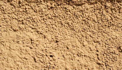 Texture of old wall covered with brown stucco