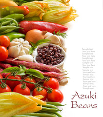 Raw azuki beans in a bowl and fresh vegetables