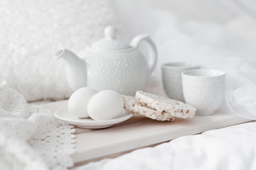 Tray with breakfast on a bed