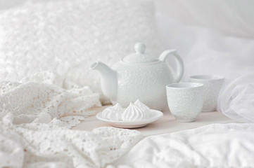 Tray with breakfast on a bed