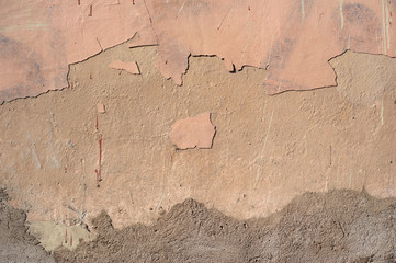Texture of old wall covered with brown stucco