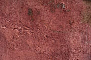 Texture of old wall covered with red stucco