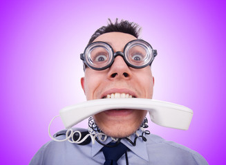 Crazy man with phone on white