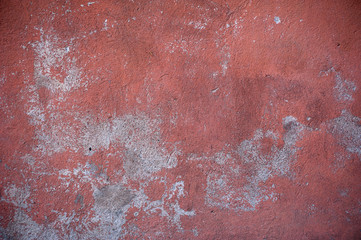 Texture of old wall covered with red stucco