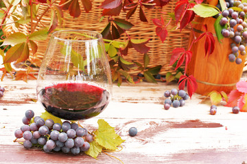 Glass of wine on wooden background 