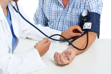 Doctor checking patient blood pressure.