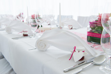 white nuptial decorated wedding table with napkin and flowers
