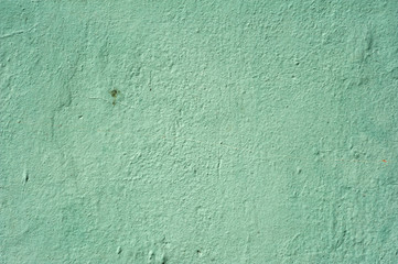 Texture of old wall covered with green stucco